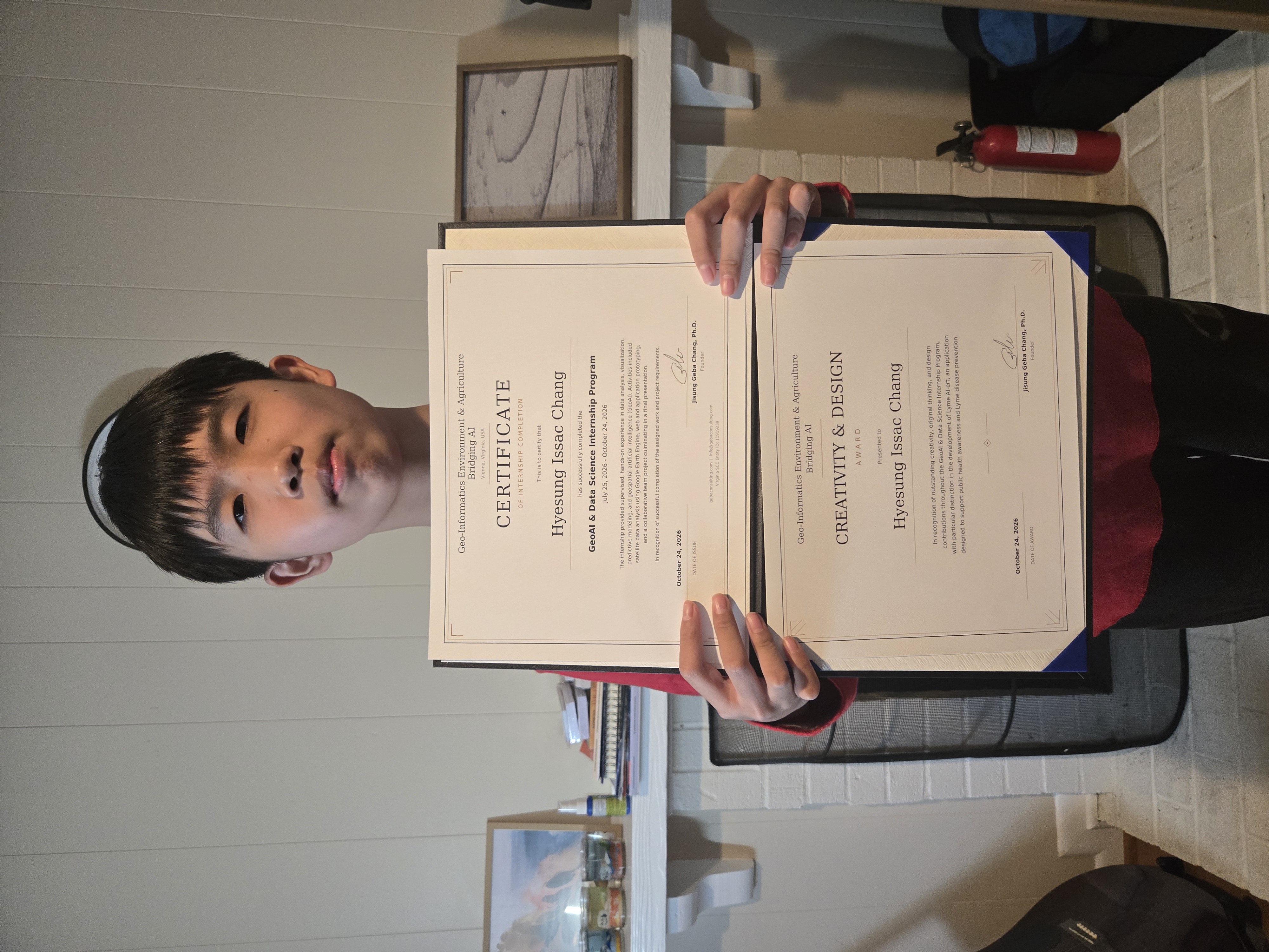 Issac receiving internship certification and Creativity and Design Award