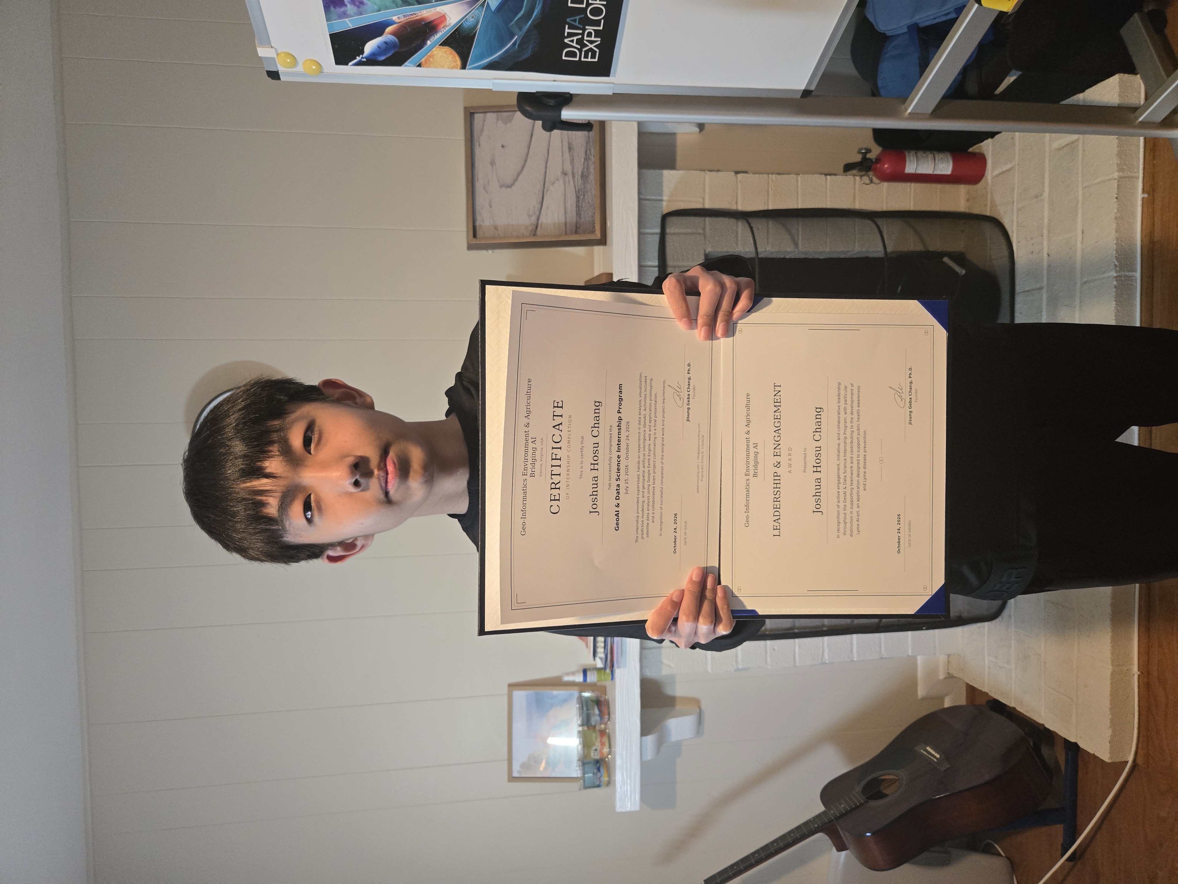 Joshua receiving internship certification and Leadership and Engagement Award